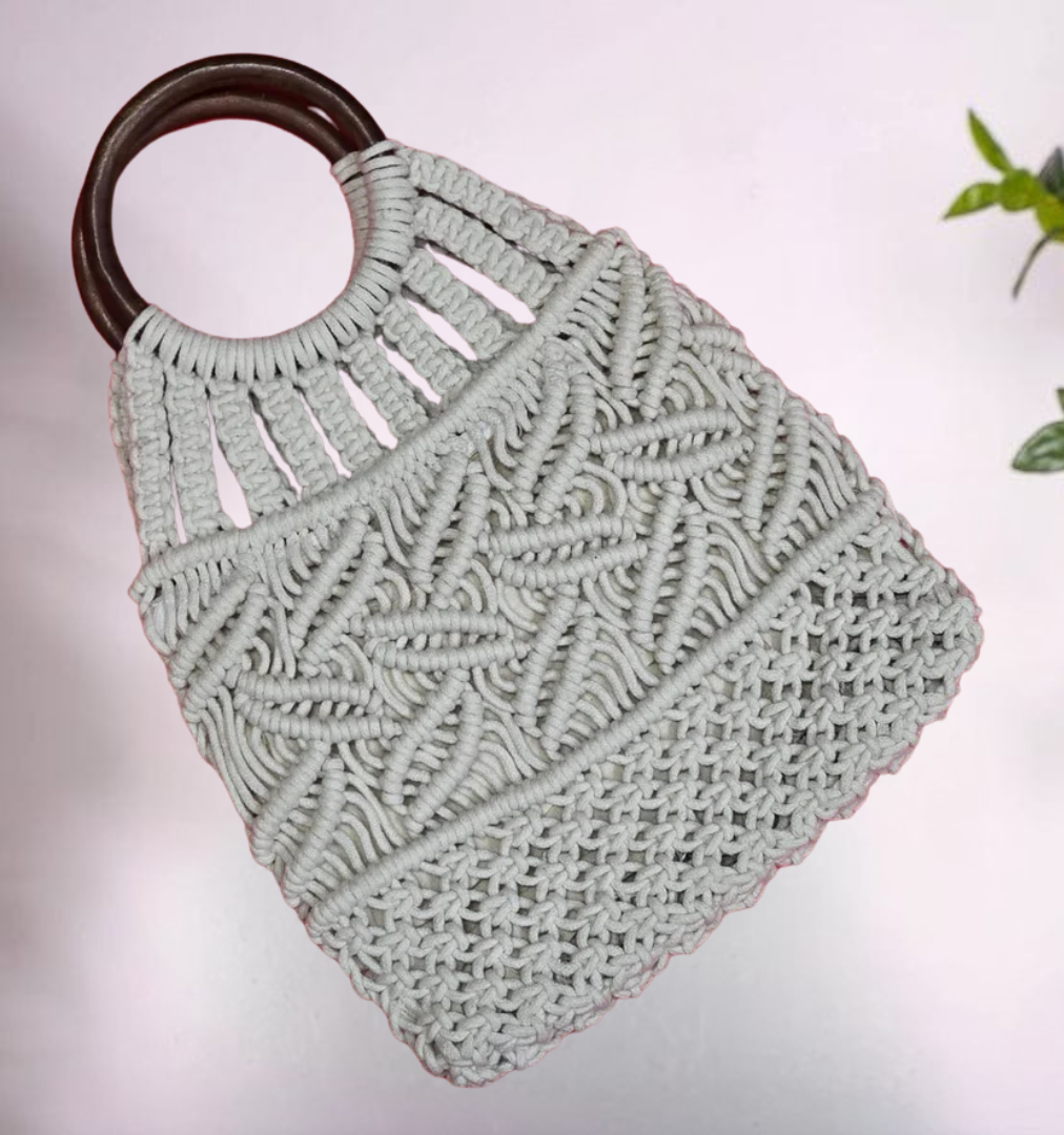 Trendy macramé knotted handbag, perfect for summer outings or beach days.