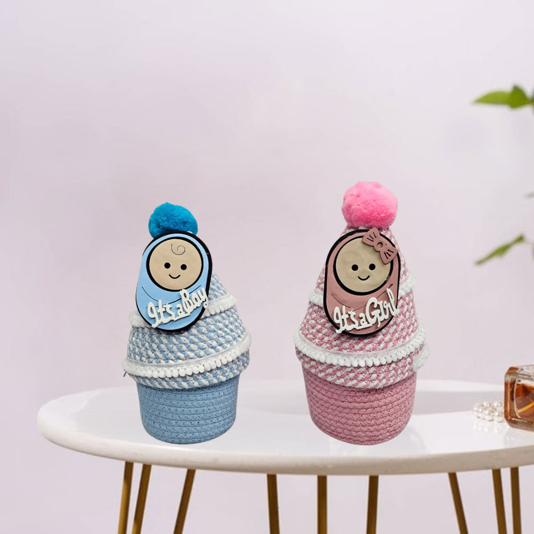 Decorative basket with feminine accents and “It’s a Girl” message, Celebratory basket with blue accents and “It’s a Boy” tag.