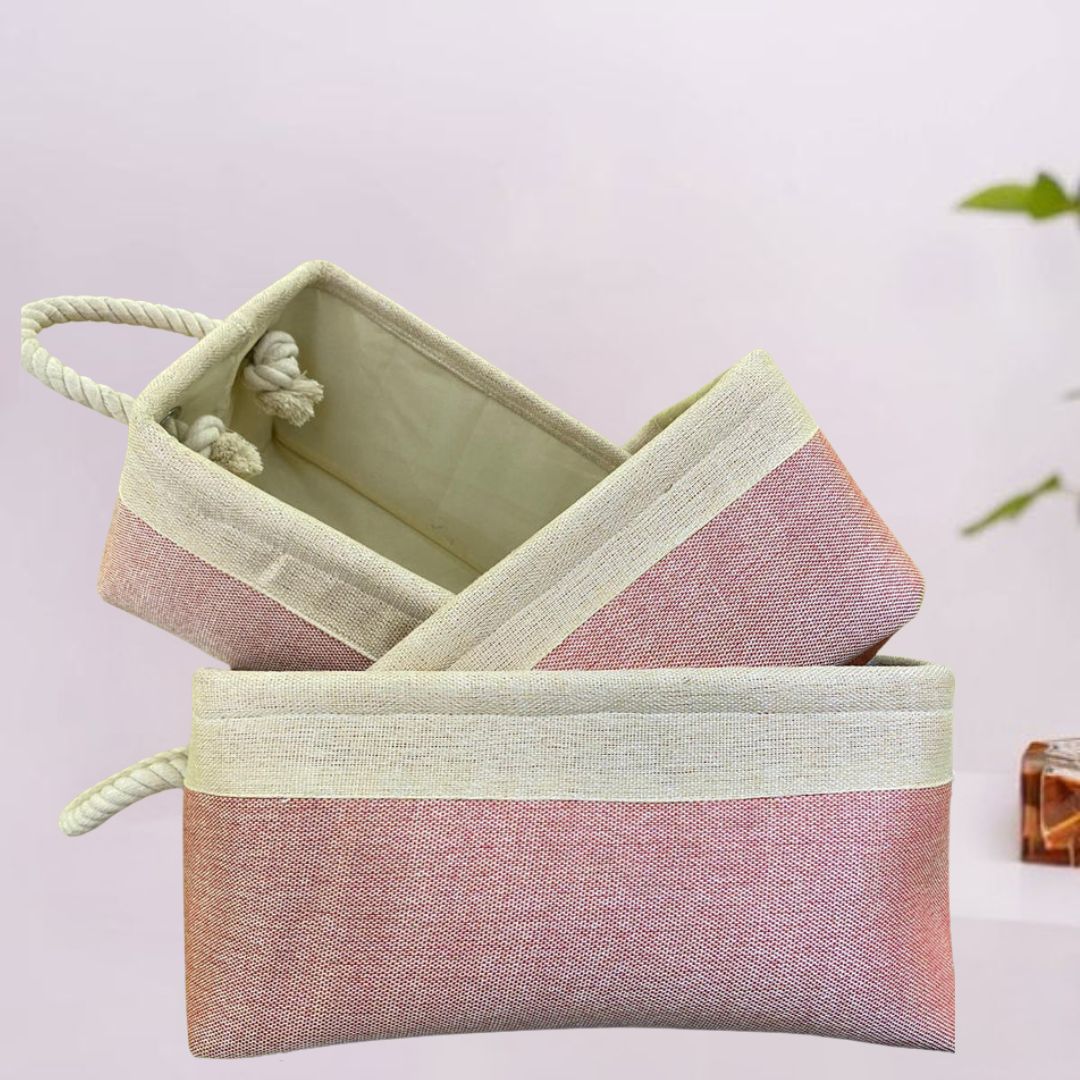Natural two-tone jute basket with a decorative handle for storage or display.