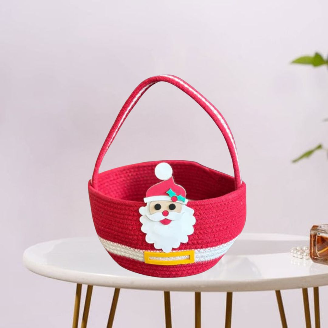 It’s a red festive basket with a Santa face and belt design—perfect for Christmas treats or decor.
