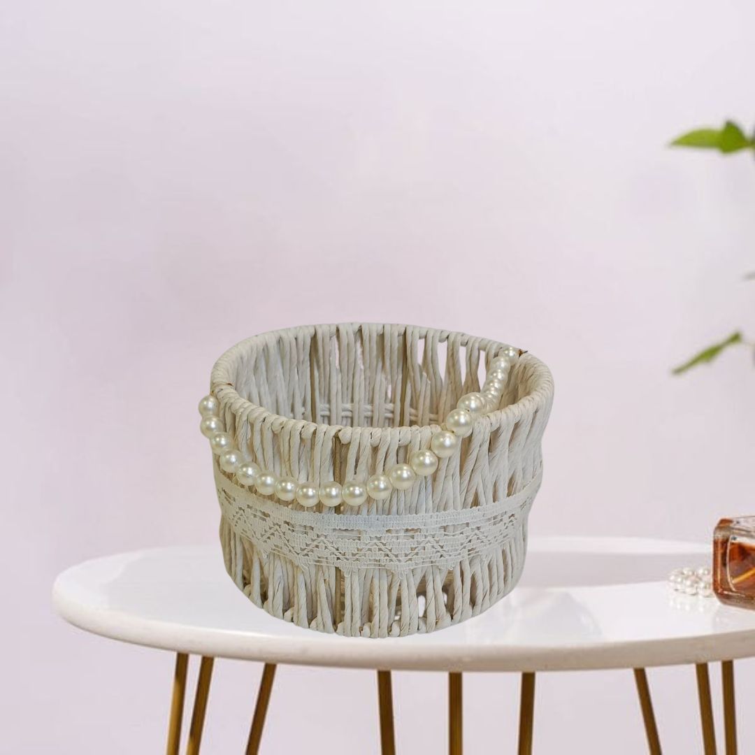 Eco-friendly raffia basket with intricate white beaded handle.