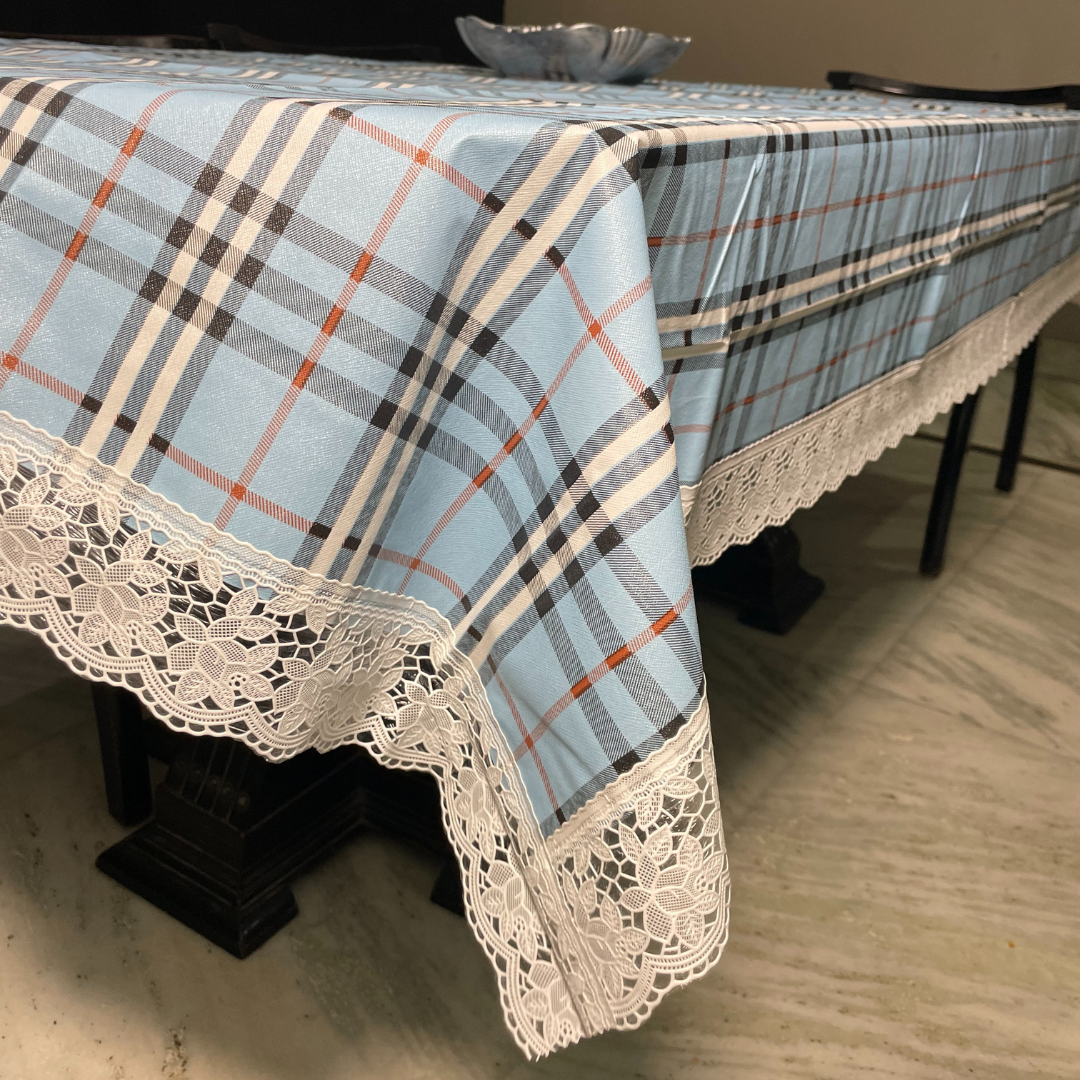 blue color burberry table cover for 6 seater dining table check printed design close view of lace