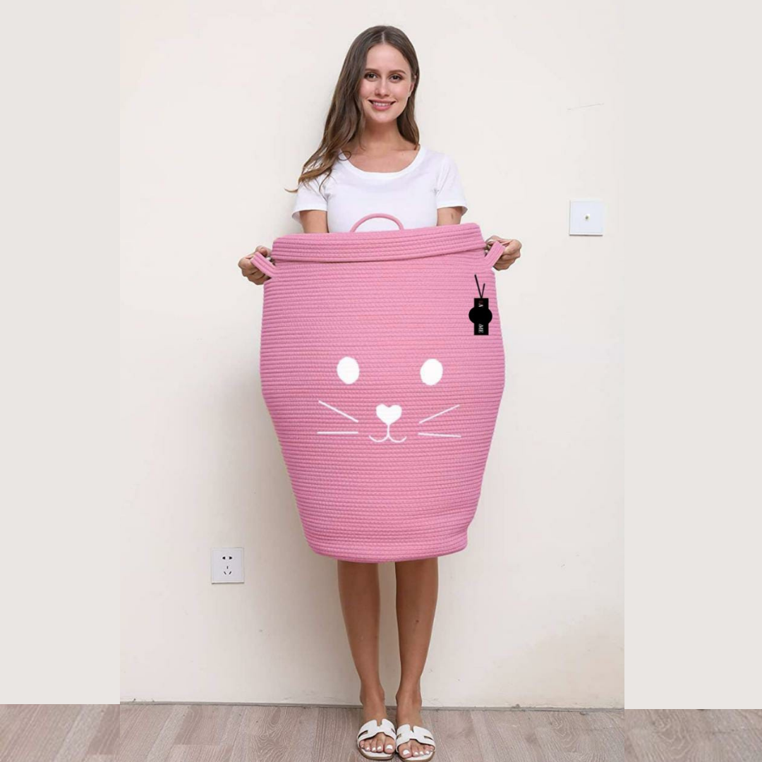 Cat-Face-Storage-Basket-With-Lid-in-Pink-Color-Woman-it-With-Strong-Handles-in-Background