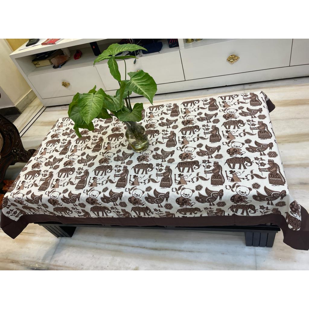 Loomsmith-floral-printed-cotton-fabric-table-cover-with-coffee-border-with-elephant-print-plant-placed-on-the-table
