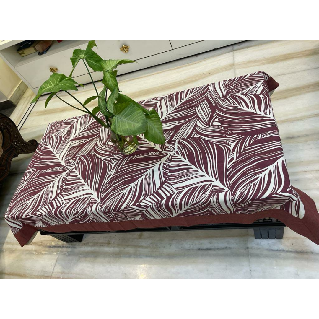 Loomsmith-floral-printed-cotton-fabric-table-cover-with-purple-border-plant-placed-on-the-table