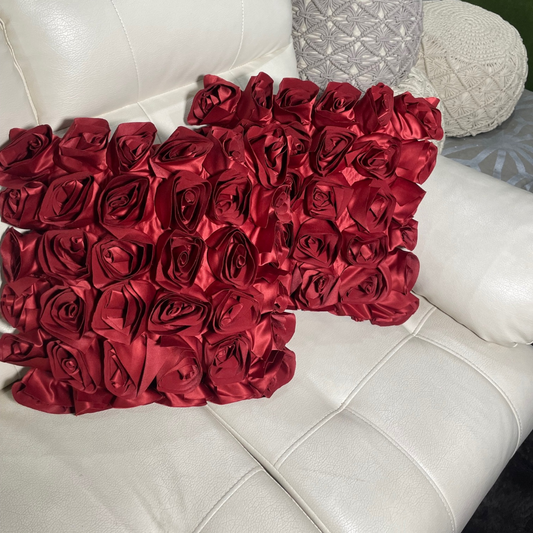 Loomsmith-rose-floral-theme-cushion-cover-set-of-two-red-color-close-view-lying-on-sofa