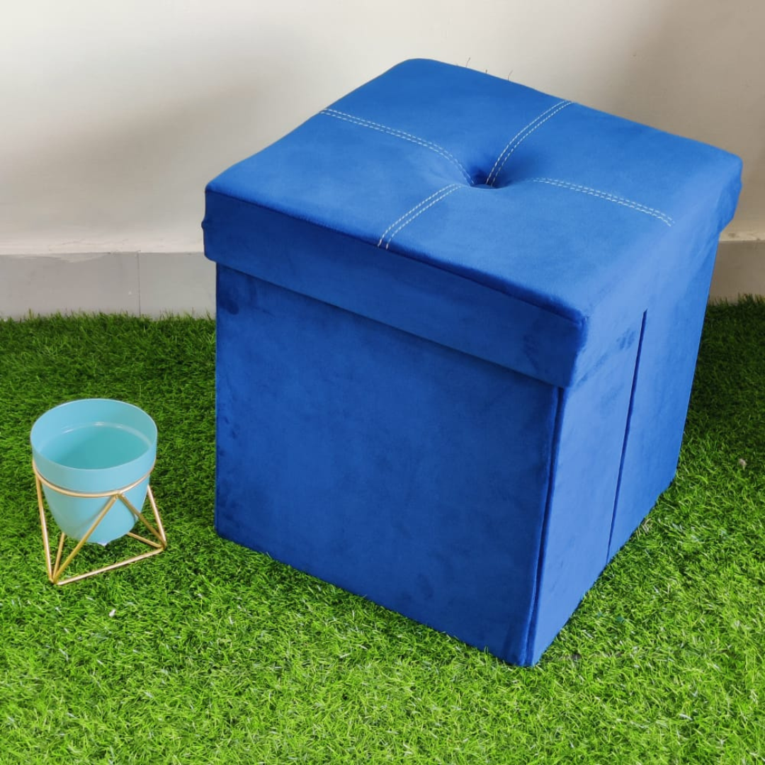 solid blue color velvet storage box with stool foam sitting small pot placed near stool on faux grass floor