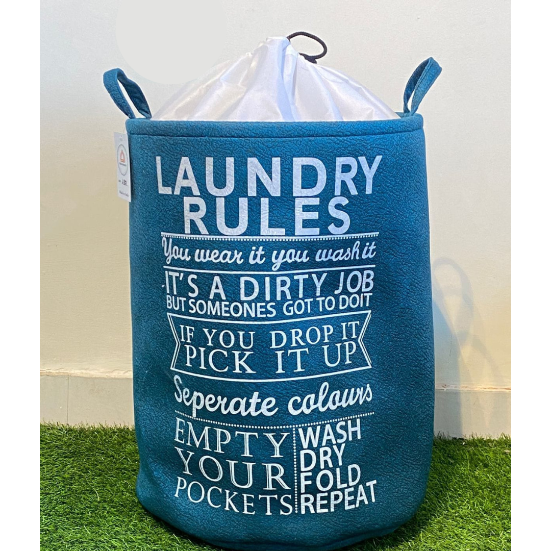 printed-laundry-basket-in-blue-color-with-closure-placed-on-green-faux-floor