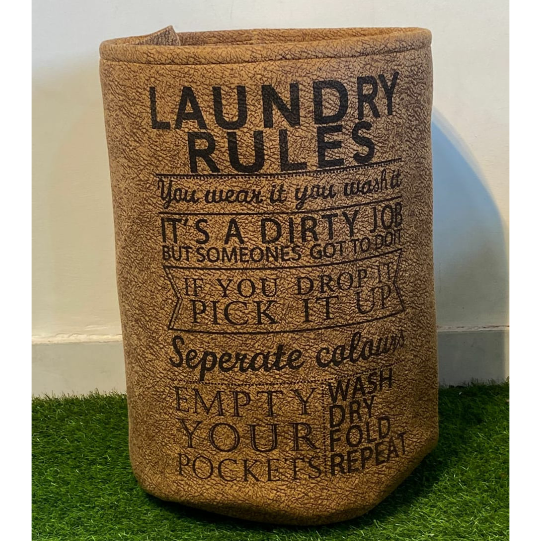 printed-laundry-basket-in-brown-color-with-drawstring-closure-placed-on-green-faux-floor