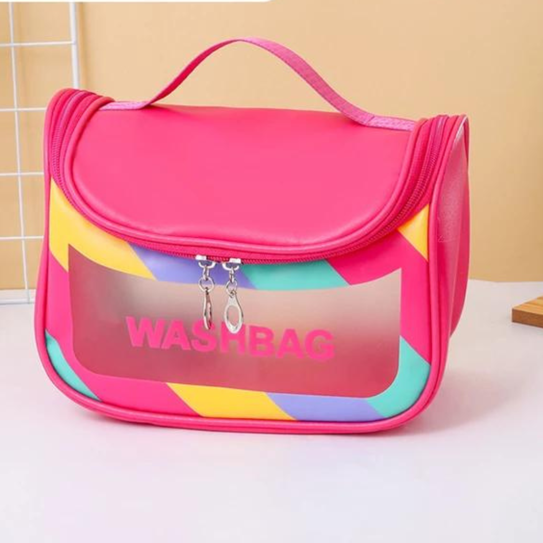 dual zipper pink  colour cosmetic storage bag with strong handle and transparent window placed on white table with beige background