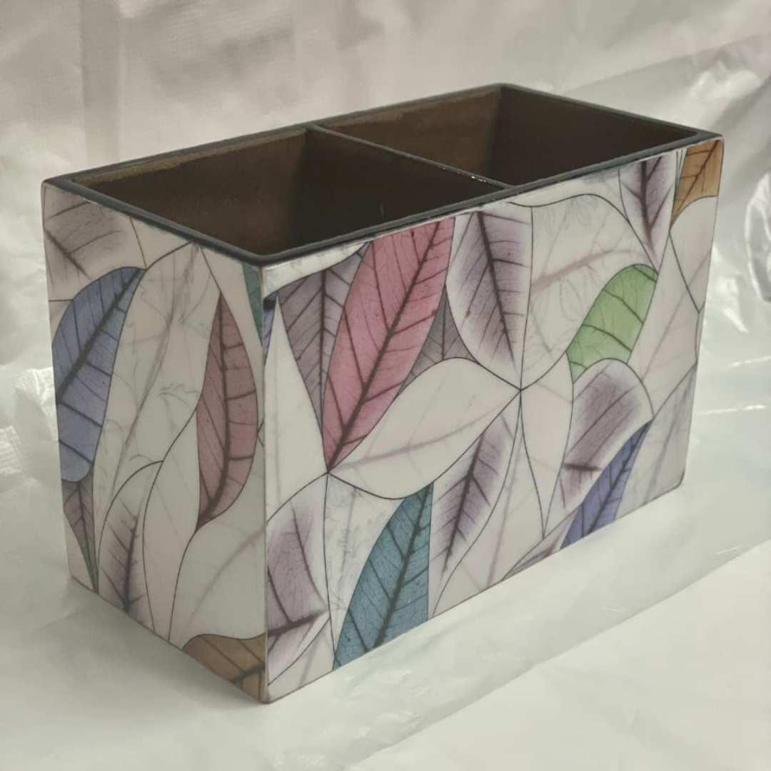 wooden-printed-cutlery-holder-white-colour-different-coloured-leaves-pattern-on-it-lying-on-the-form-holder-have-two-block-storage