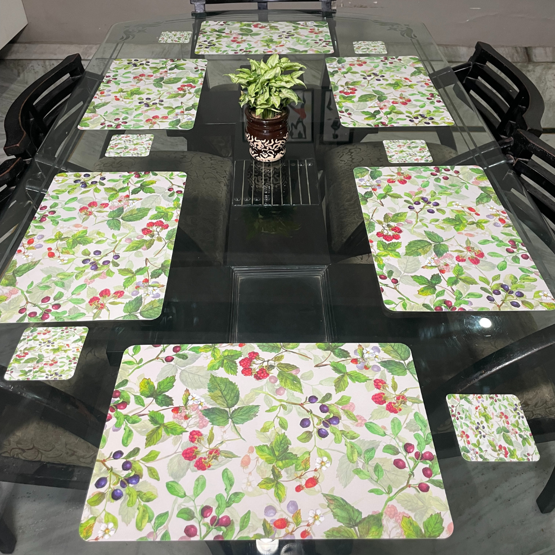 floral all over printed design in dark green color dining mats set of 6 with tea coasters placed on glass dining table zoom view