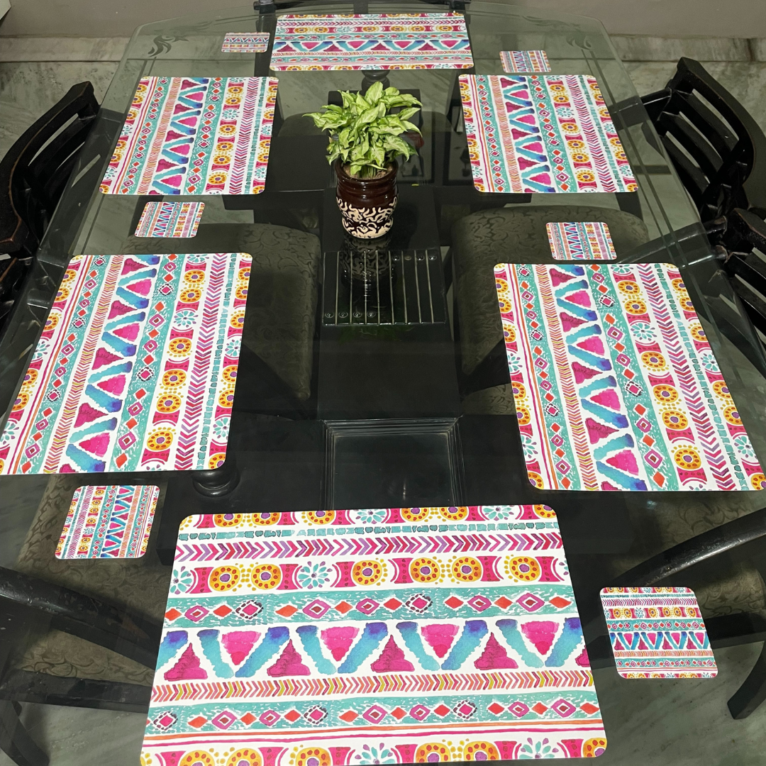  abstract print design in pink color dining mats set of 6 with tea coasters placed on glass dining table set of 6