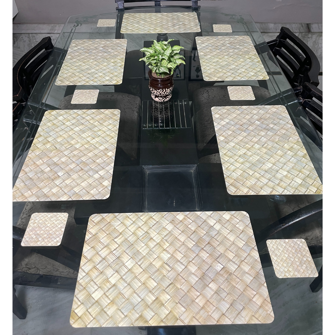 check printed design in brown color dining mats set of 6 with tea coasters placed on glass dining table 