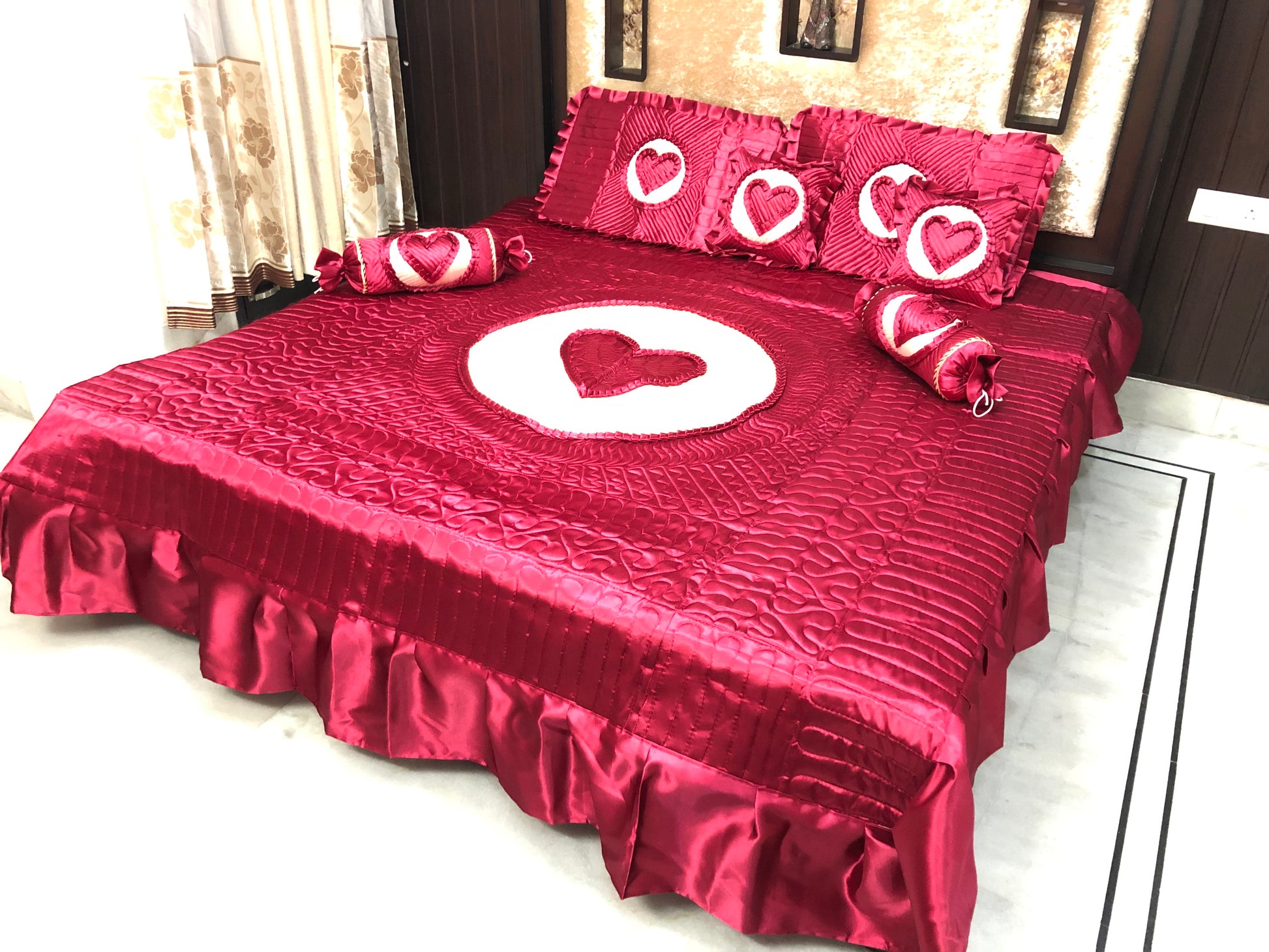 loomsmith-satin-bedsheet-set-of-7-heart-design-in-maroon-color-two-filled-cushions-two-filled-bolsters-King-Size-set-two-pillow-covers