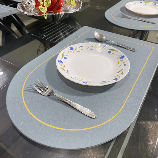 leather dining mat of Blue color placed on dining table with plates fork and spoon zoom view