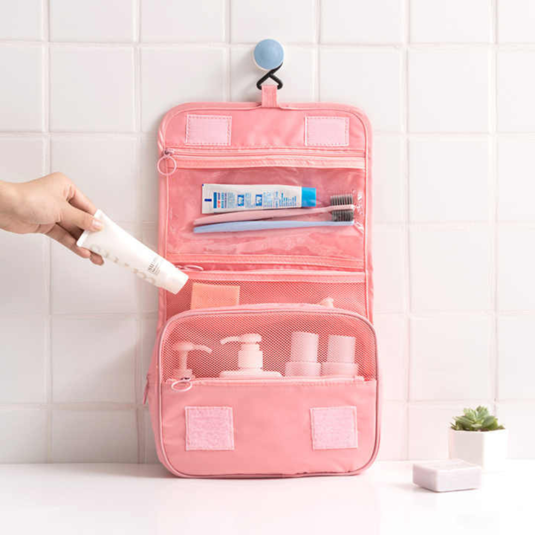portable bag in pink color placed on shelf with hang hook mesh pocket design 