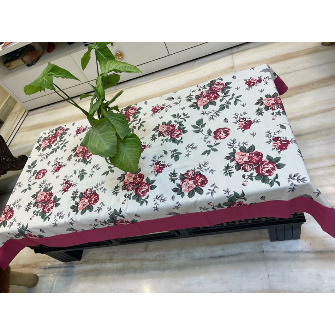 Loomsmith-floral-printed-cotton-fabric-table-cover-with-pink-border-plant-placed-on-the-table