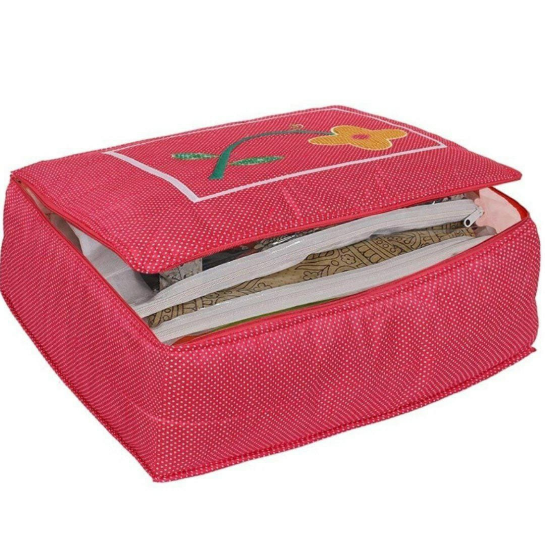 saree cover bag with 12 transparent flaps with zipper pockets in pink color printed with polka dots and flower designs 