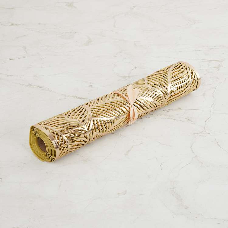 metallic look table runner in gold color leaf pattern packed round