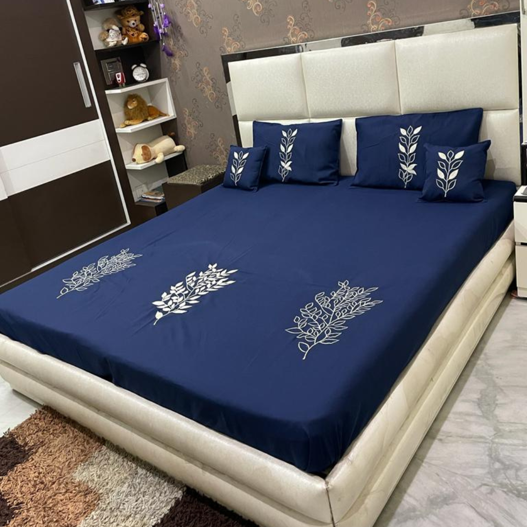 blue color glace cotton bedsheet with embroidery design on bedsheet, filled cushions and pillow covers bedding set