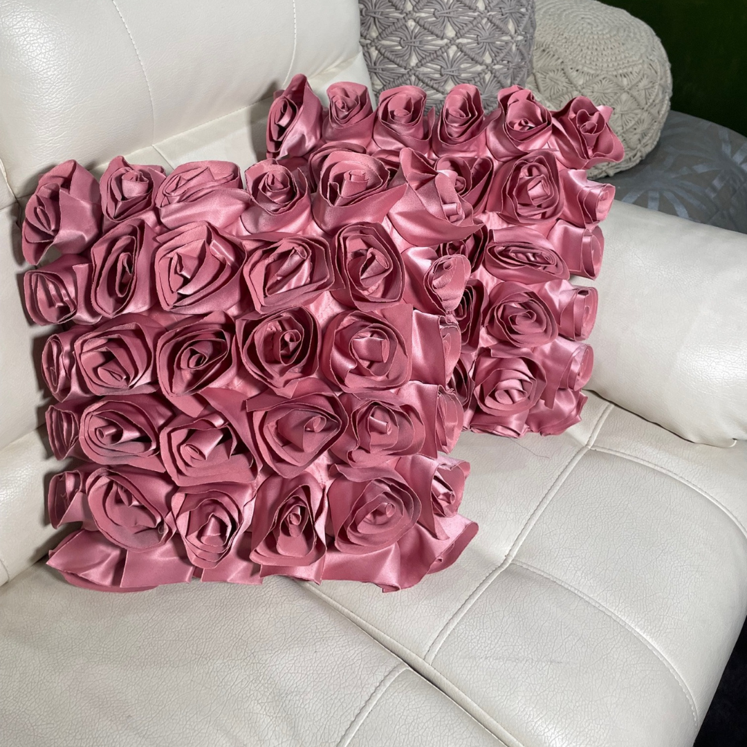    Loomsmith-rose-floral-theme-cushion-cover-set-of-two-pink-color-close-view-lying-on-sofa
