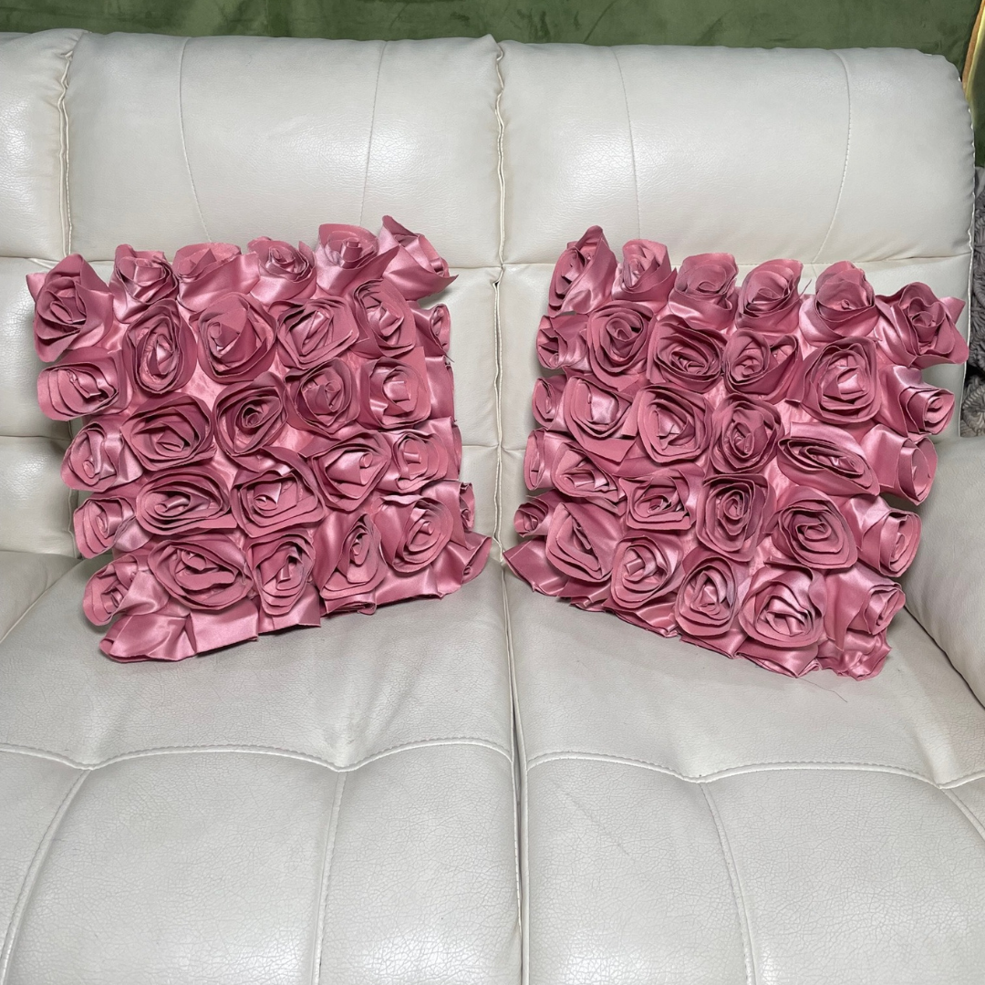 Loomsmith-rose-floral-theme-cushion-cover-set-of-two-pink-color-lying-on-sofa