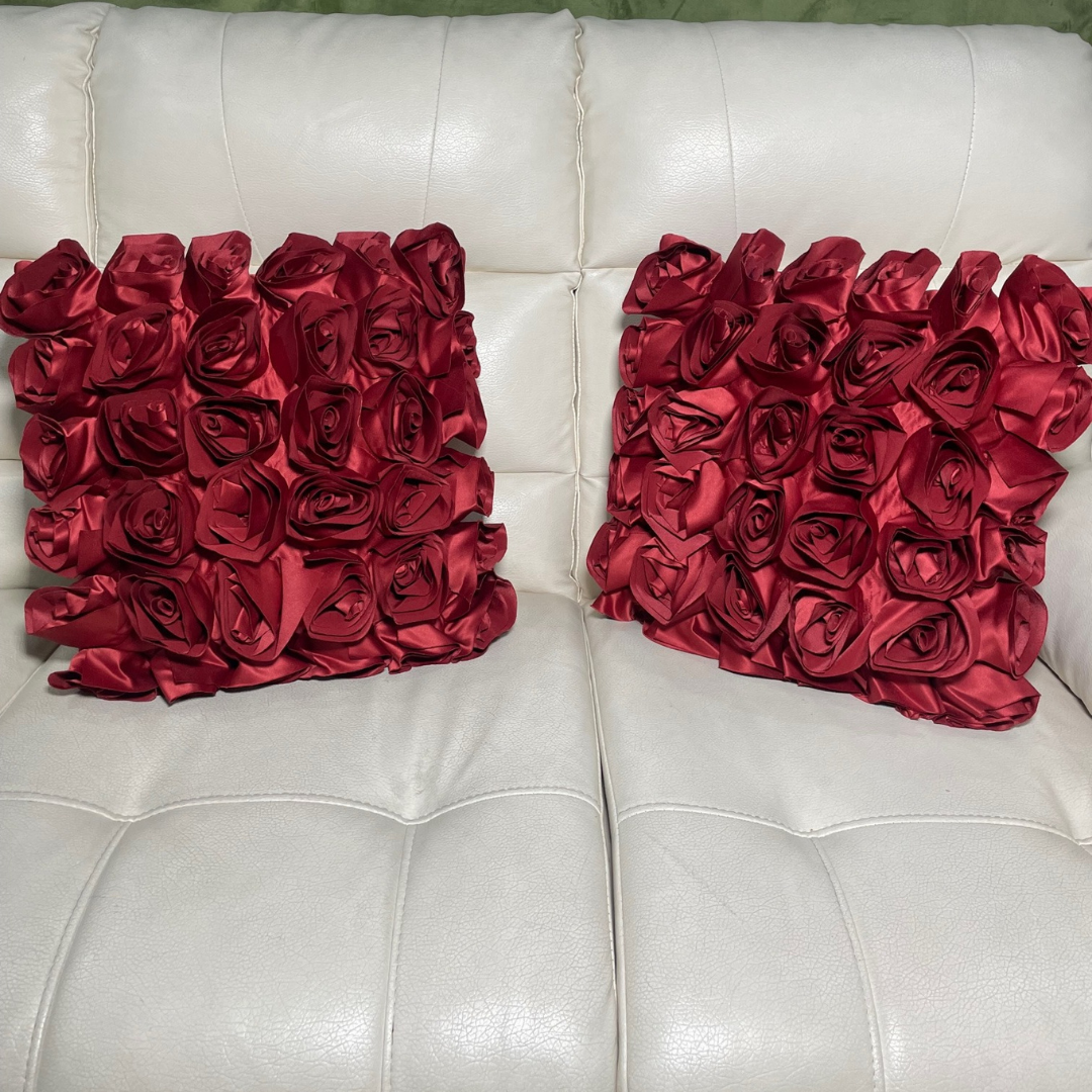 Loomsmith-rose-floral-theme-cushion-cover-set-of-two-red-color-lying-on-sofa