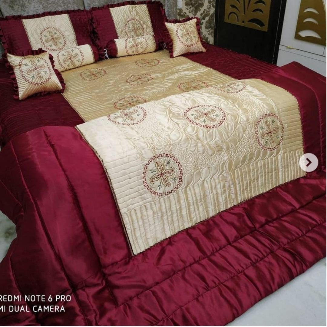 Loomsmith-satin-wedding-bedsheet-8pcs-set-king-size-maroon-colour-two-pillow-two-bolster-two-cushions-one-quilt-and-one-bedsheet-pillows-cushions-quilt-are-placed-on-bed-with-