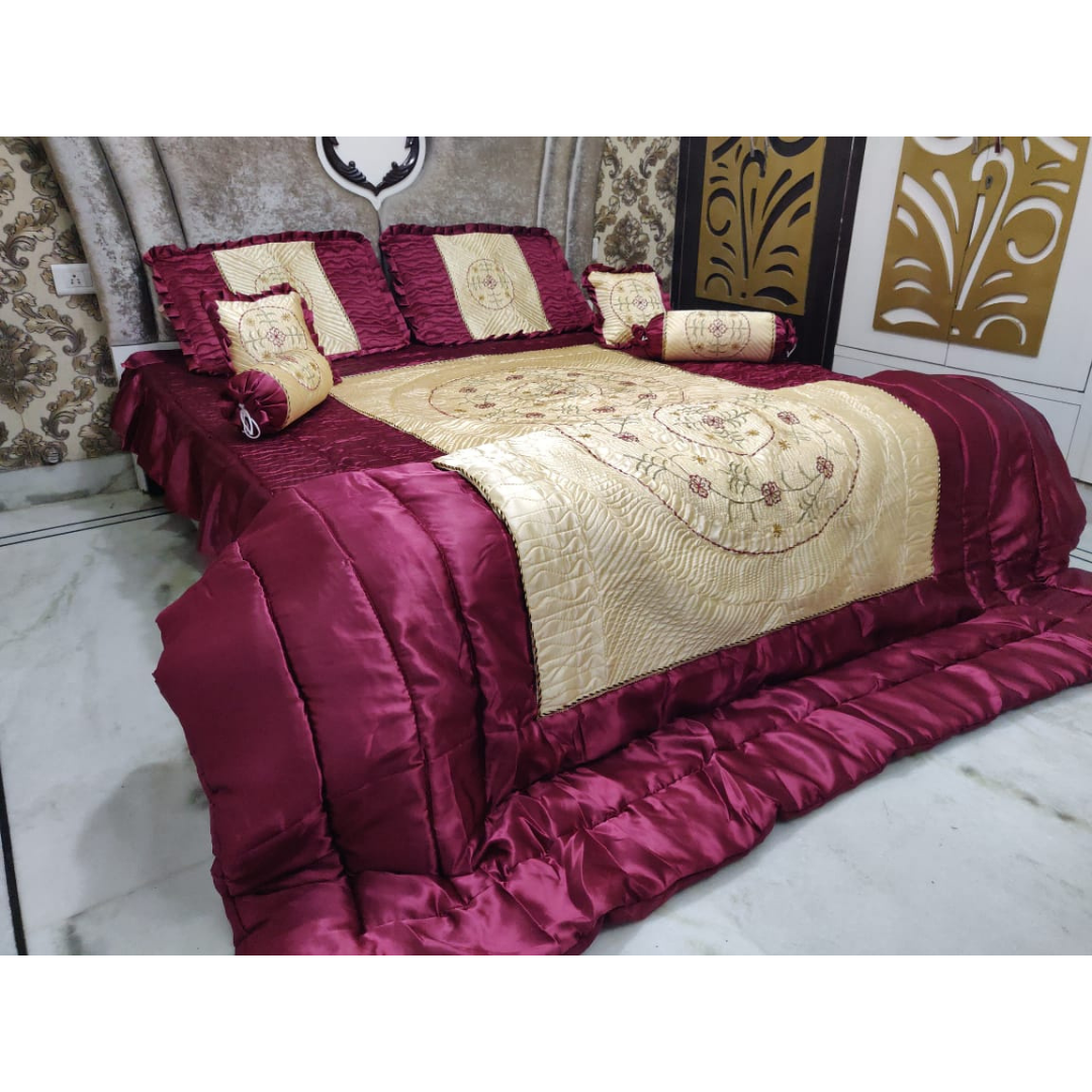Loomsmith-satin-wedding-bedsheet-8pcs-set-king-size-wine-colour-two-pillow-two-bolster-two-cushions-one-quilt-and-one-bedsheet-pillows-cushions-quilt-are-placed-on-bed-with-
