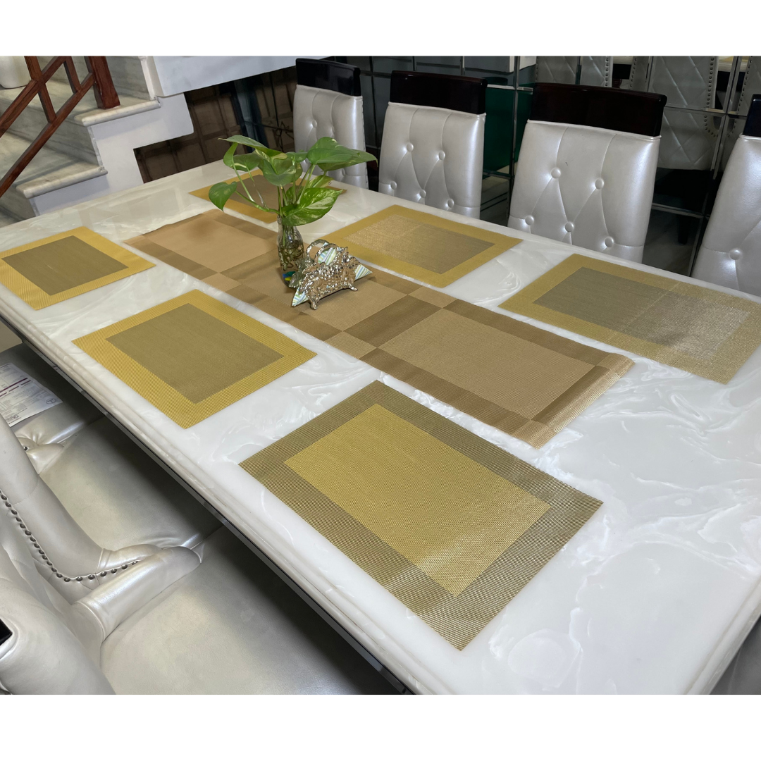 six placemats with one table runner in green color on white six seater dining table accessorized with vase and napkin holder