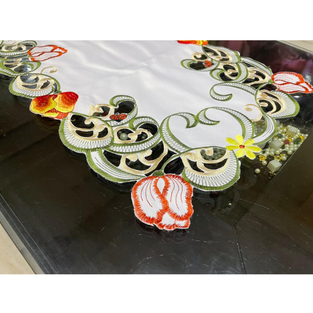 tissue fabric center table embroidered with orange yellow flowers green leaf design placed on center table zoom view