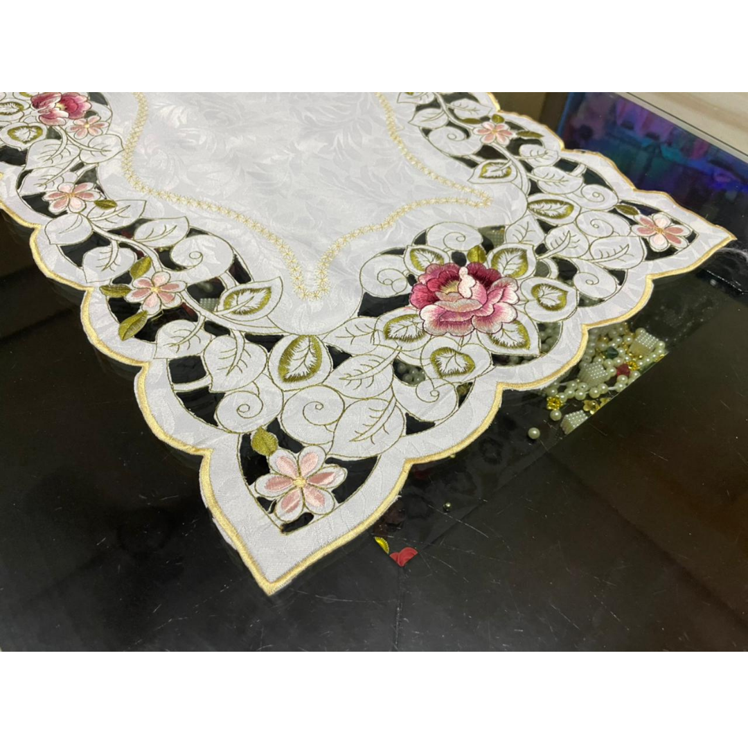 tissue fabric center table embroidered with pink flowers green leaf design placed on center table zoom view