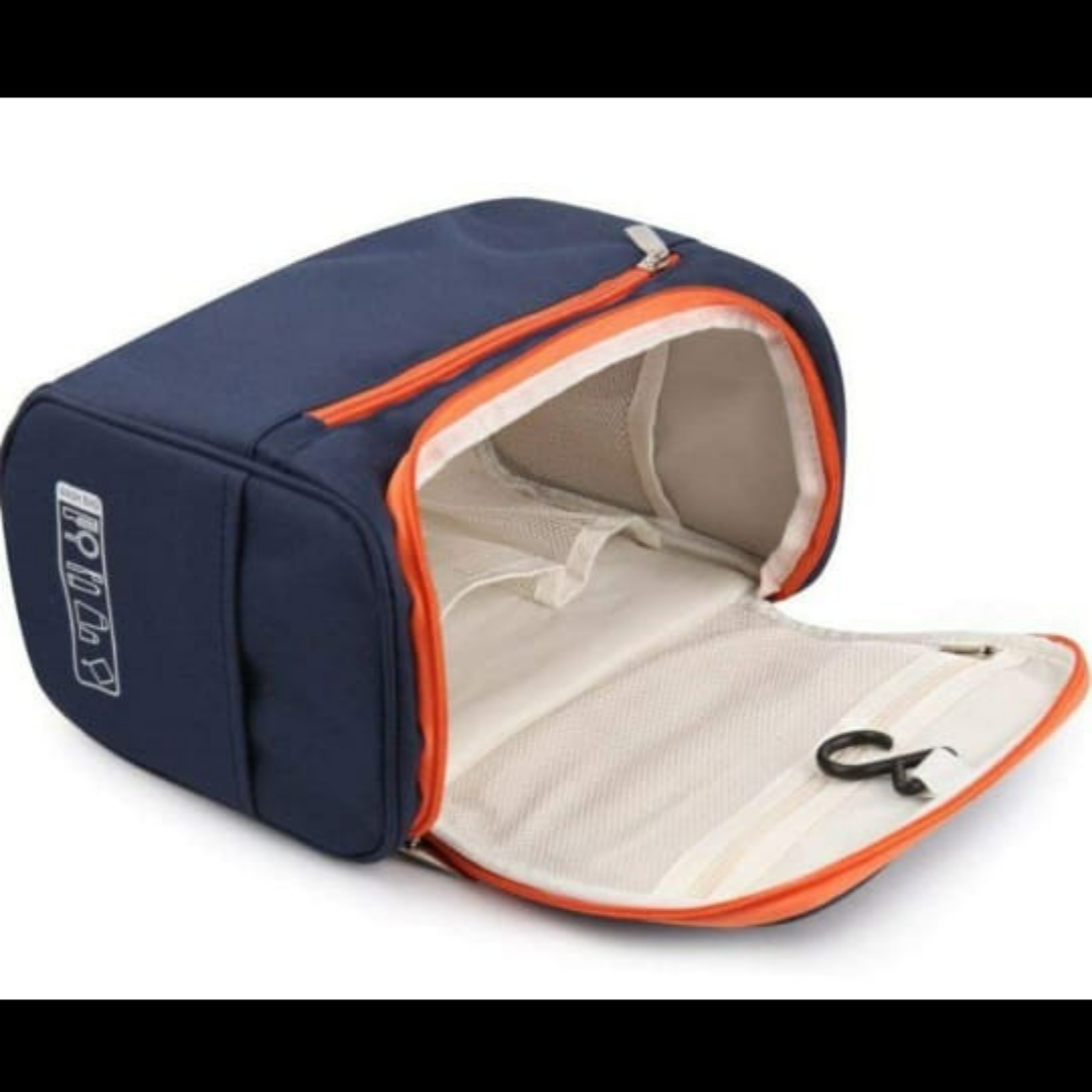 navy blue color cosmetic organizer kit with orange zipper lying open and hanging hook inside