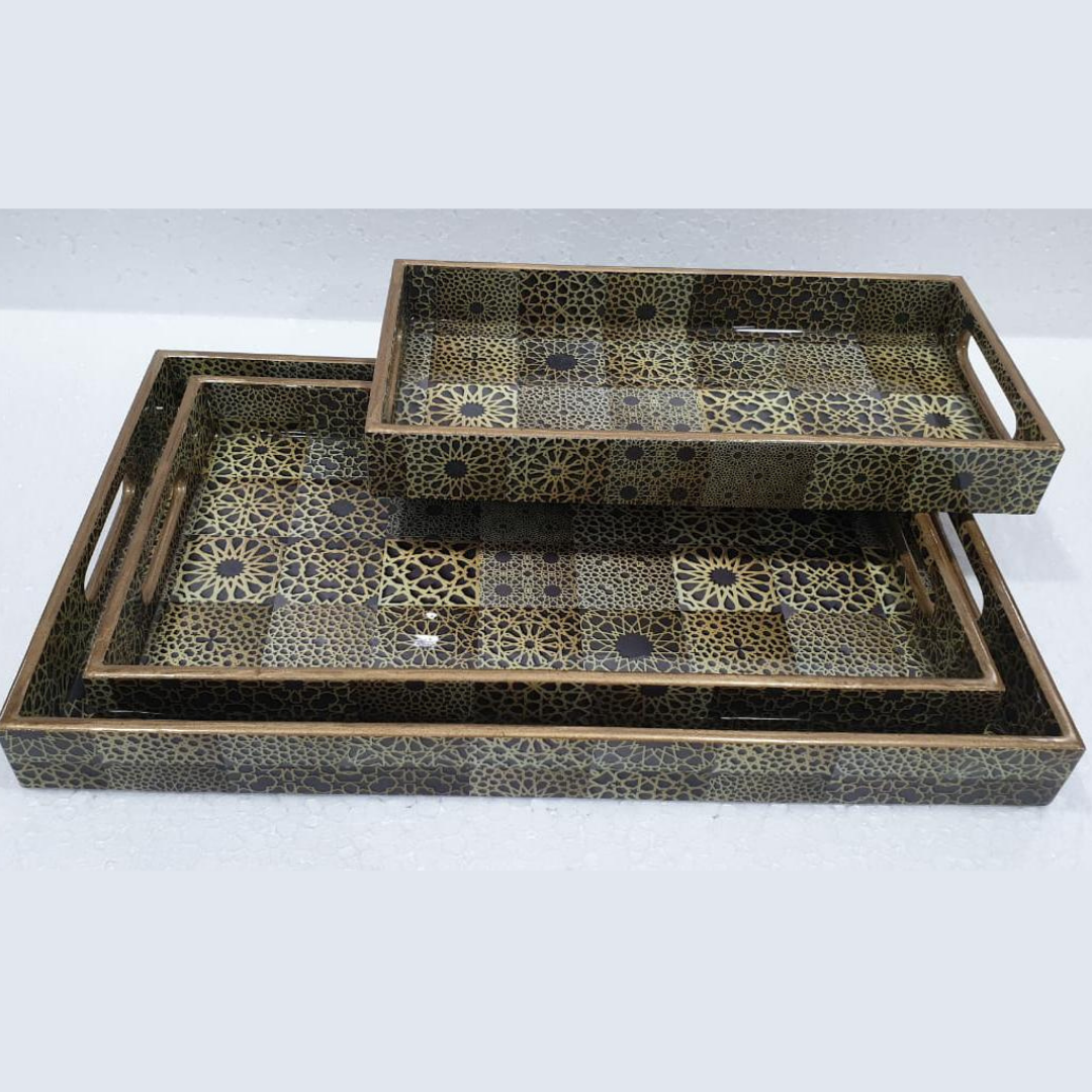 Loomsmith-wooden-tray-set-of-3-with-different-shades-of-brown-flowered-pattern-lying-on-the-table-trays-are-in-three-different-