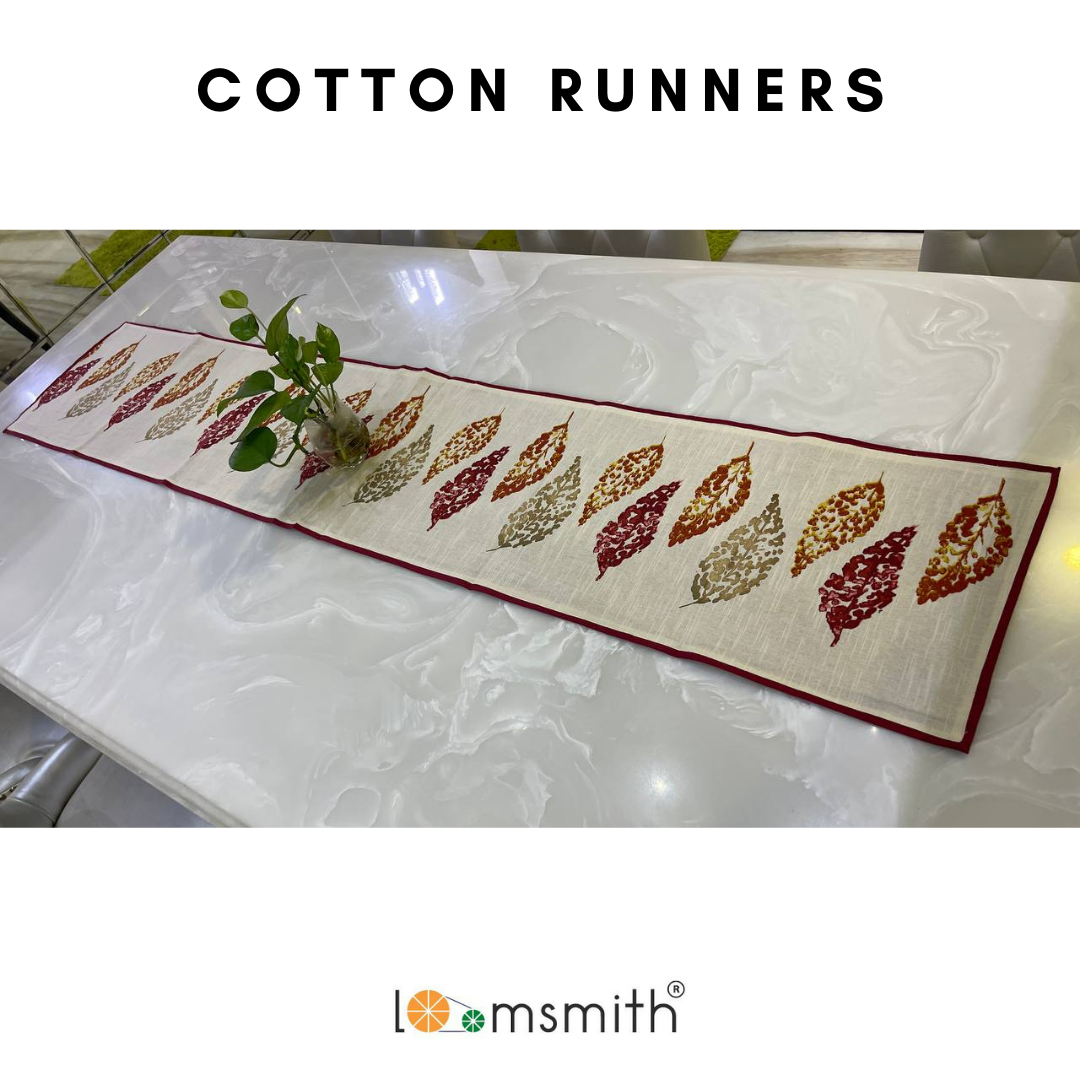 loomsmith-cotton-table-runner-maroon-in-color-leaves-print-with-combination-of-colors-on-light-base-borders-sewed-with-maroon-fabric