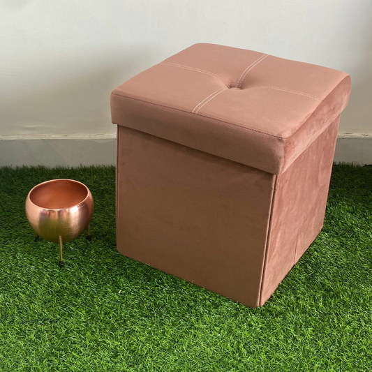 solid brown color velvet storage box with stool foam sitting small pot placed near stool on faux grass floor