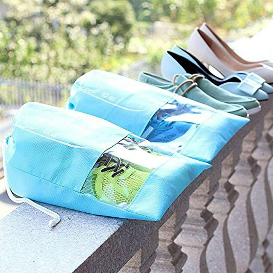 Shoe-bag-cover-in-sky-blue-set-of-six-with-string-closure-lying-on-the-wall-with-shoe-in-it-protect-from-dust-portable-shoe-pouch-with-string-can-be-used-as-footwear-wardrobe-organizer