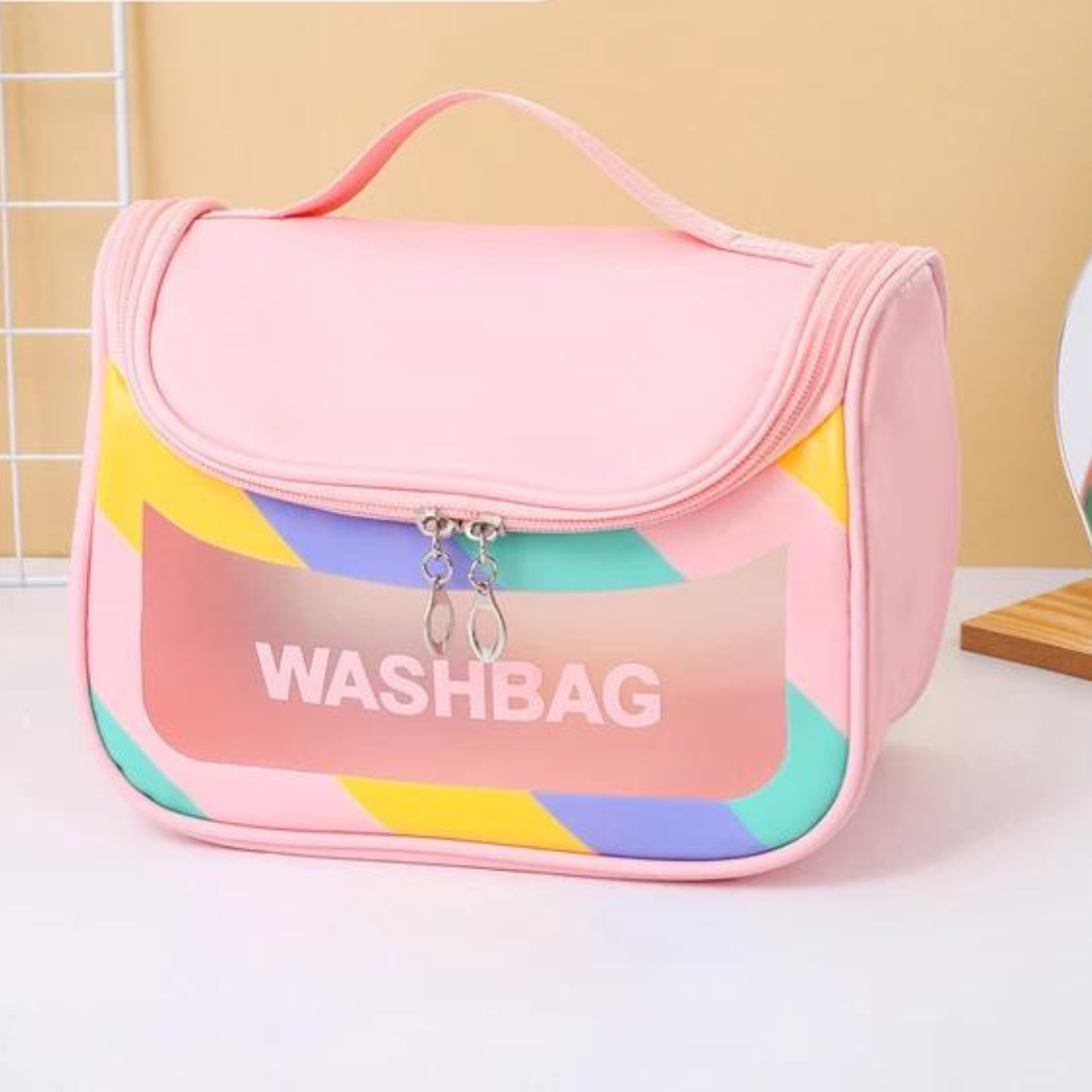 dual zipper pink  colour cosmetic storage bag with strong handle and transparent window placed on white table with beige background