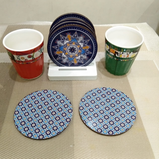 loomsmith-reversible-circular-wooden-coaster-geometric-print-set-of-six-with-stand-placed-on-table-with-glasses-blue-color